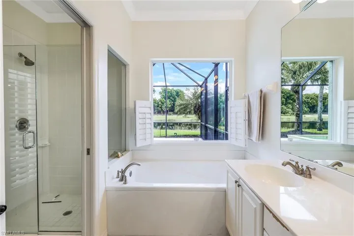 Master Bathroom with dual sinks, soaker tub and a wealth of natural light