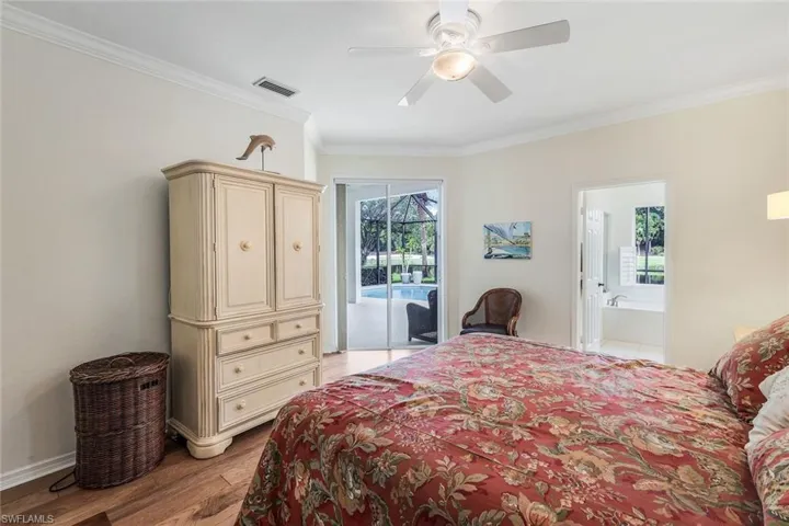 Bedroom with light hardwood / wood-style floors, crown molding, access to exterior, and ceiling fan