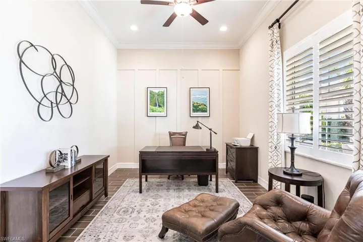 Office space featuring ornamental molding, a ceiling fan, wood finished floors, and recessed lighting