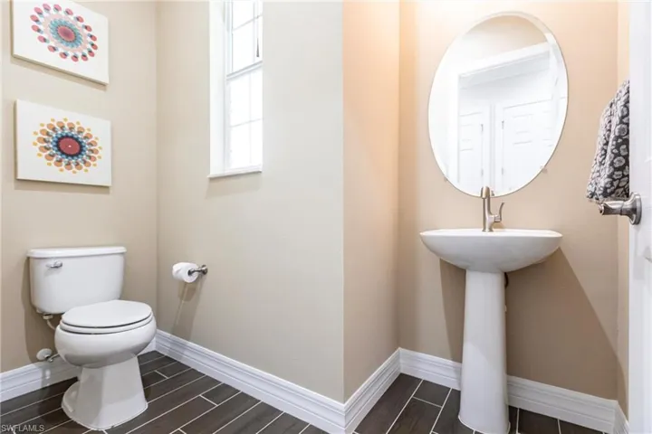 Half bathroom featuring wood finish floors