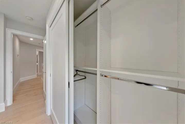 Walk in closet featuring light hardwood / wood-style flooring