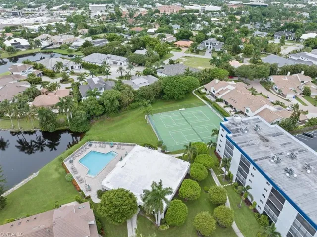 Birds eye view of property featuring a water view