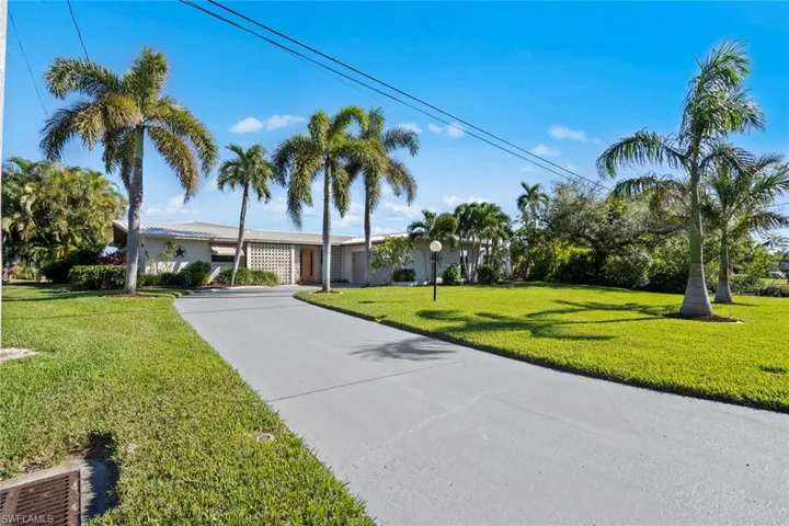 Single story home featuring a front yard