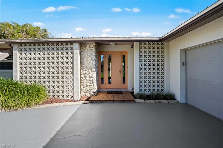 Entrance to property featuring a garage