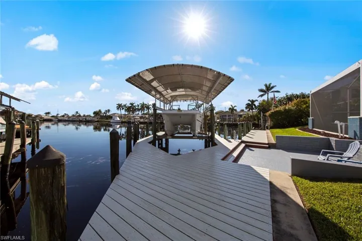 Dock area featuring a water view
