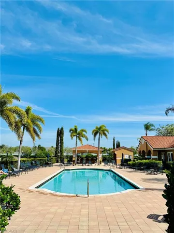 Community pool featuring a patio