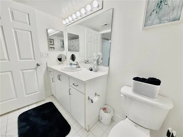 Bathroom with vanity and light tile patterned floors