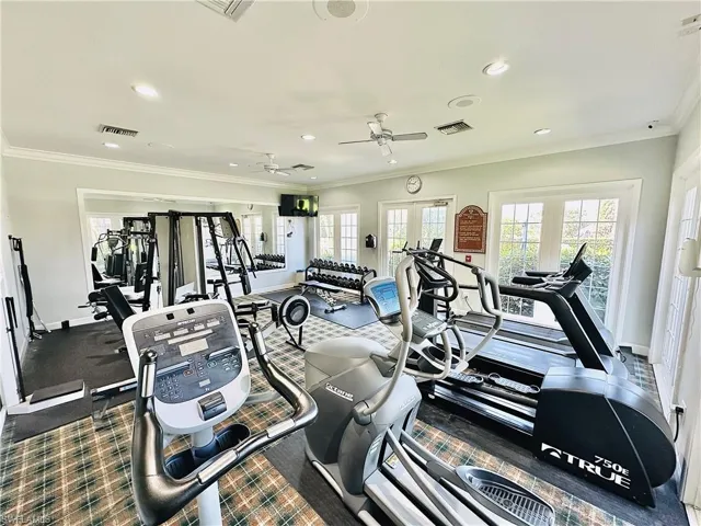Workout area with ornamental molding, recessed lighting, a ceiling fan, and french doors