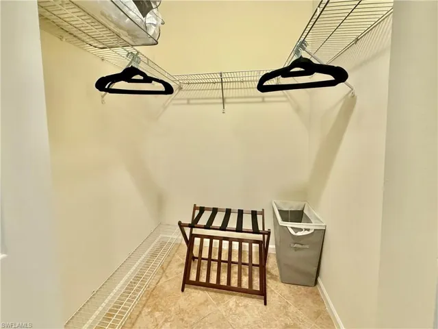 Spacious closet with tile patterned floors