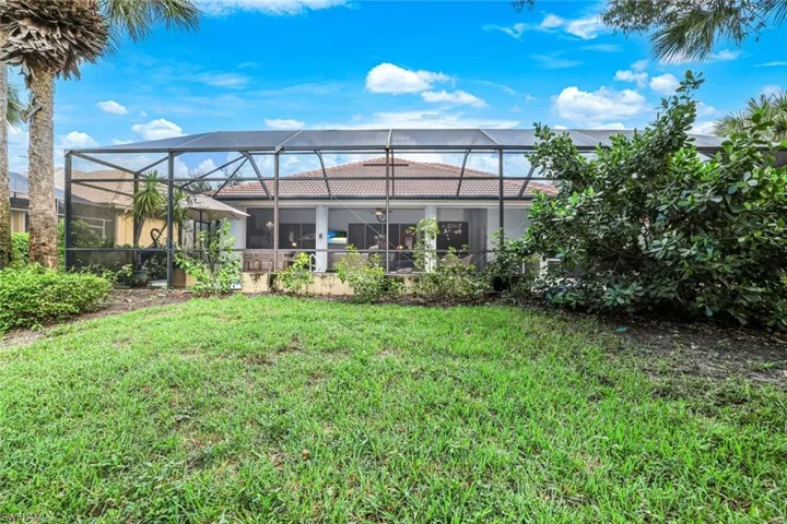View of yard with a lanai