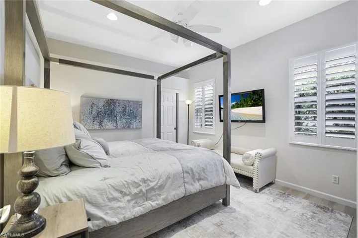 Bedroom featuring hardwood / wood-style floors and ceiling fan