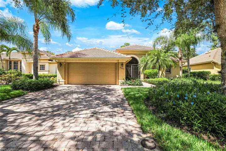 Mediterranean / spanish-style home featuring a garage