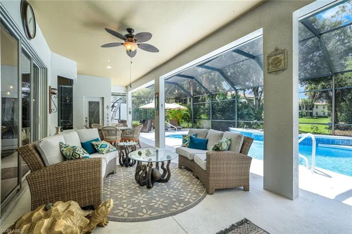 Sunroom / solarium featuring ceiling fan