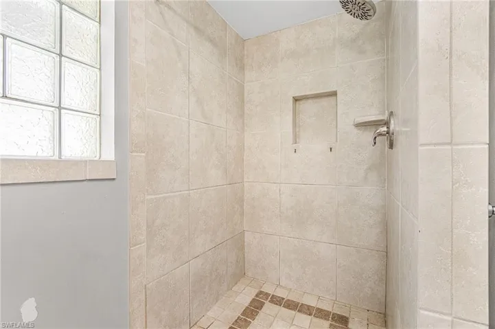 Bathroom with a tile shower