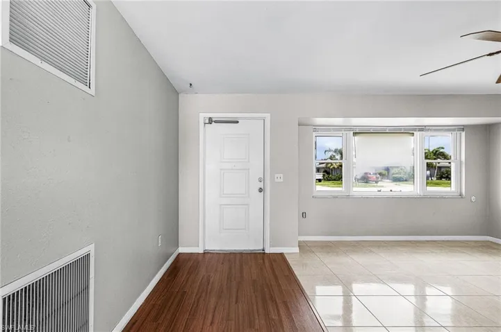 Entrance foyer featuring wood finished floors and a ceiling fan
