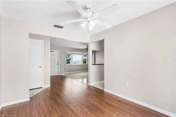 Spare room featuring light wood-type flooring and a ceiling fan