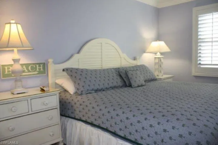 Carpeted bedroom featuring ornamental molding pre Ian