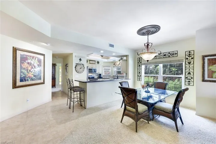 Dining area featuring light tile patterned floors