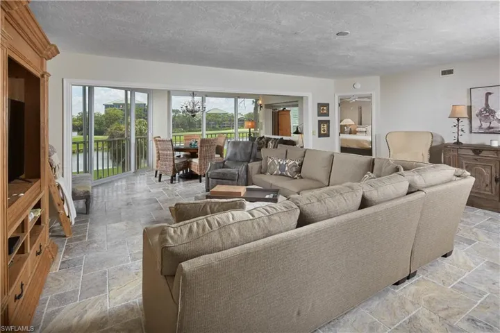 The great room boasts expansive lake and golf course views.