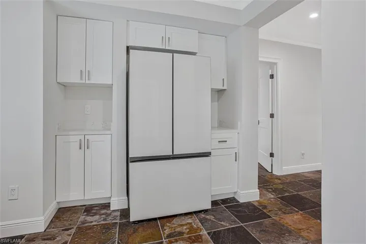1st floor snack area with full size refridge in 1st floor livingroom
