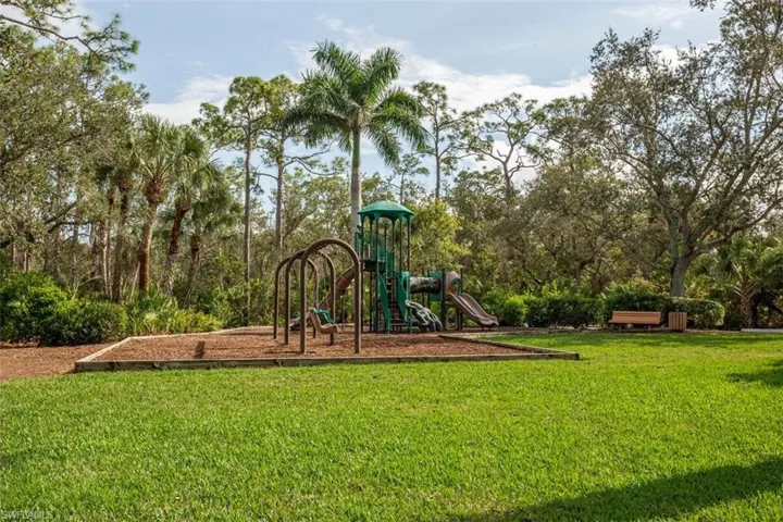 Community playground with a lawn at spring creek