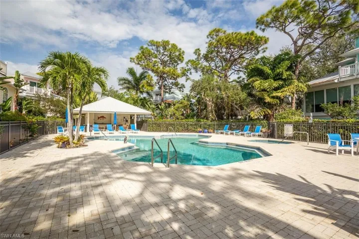 Cracker Cove Community pool with a patio