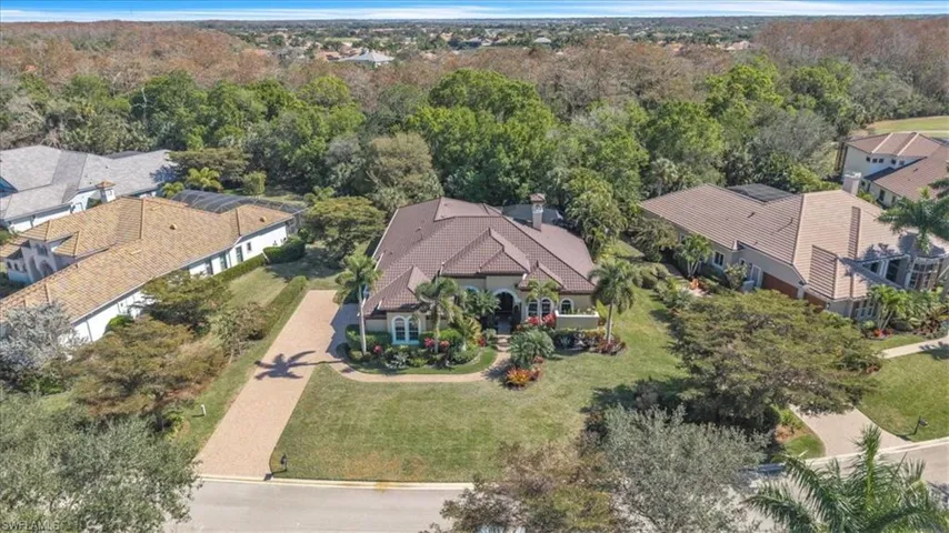 Aerial perspective of suburban area with a heavily wooded area