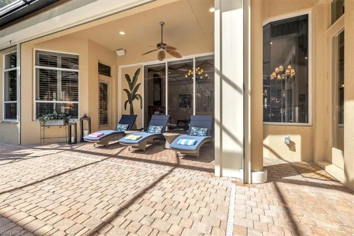 View of patio featuring ceiling fan