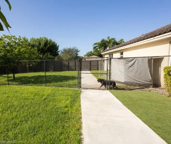 View of yard with a gate