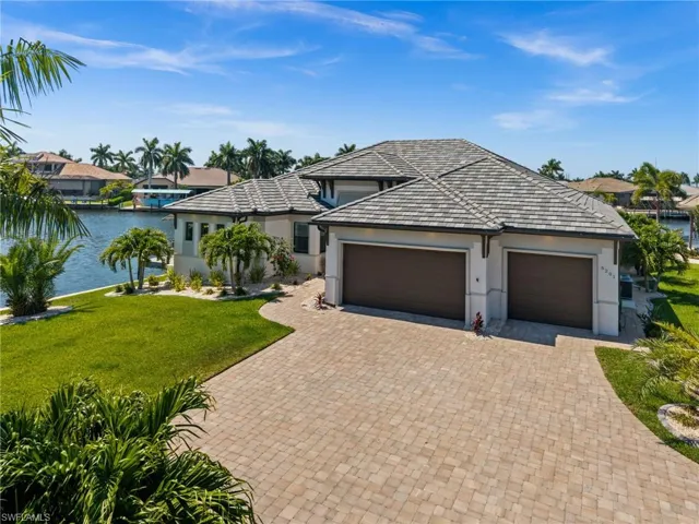 Huge paver driveway and 3 car garage