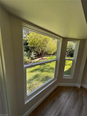 Detailed view of baseboards and wood finished floors
