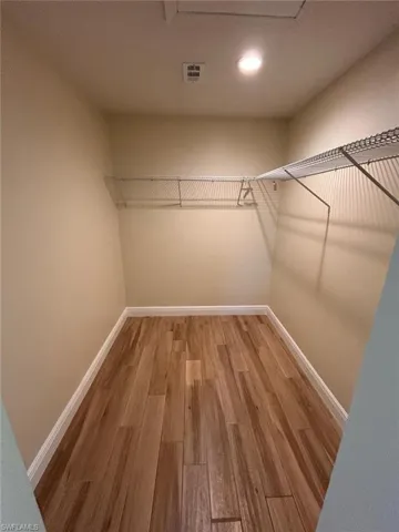 Walk in closet featuring light wood finished floors