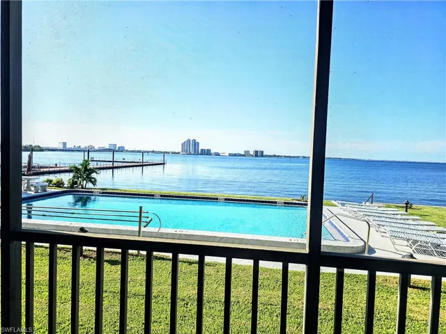 View of swimming pool featuring a water view