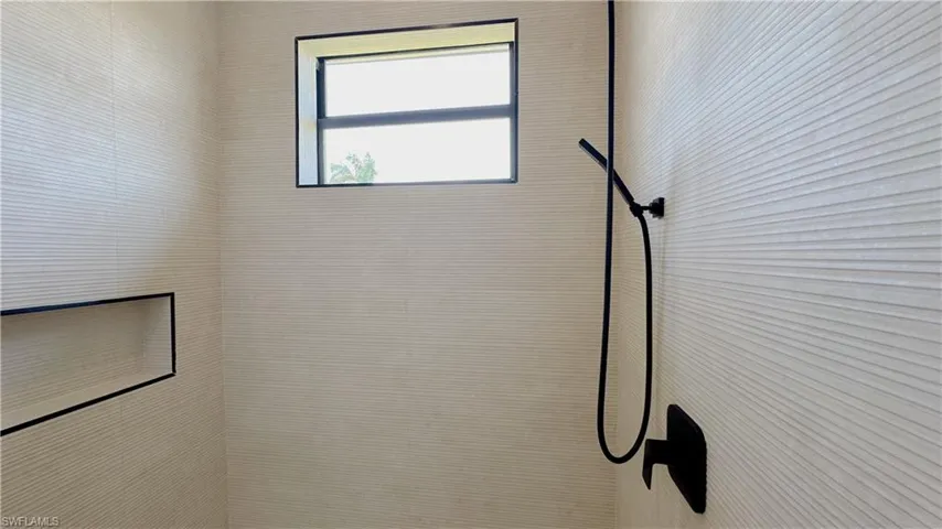 Interior details featuring tiled shower