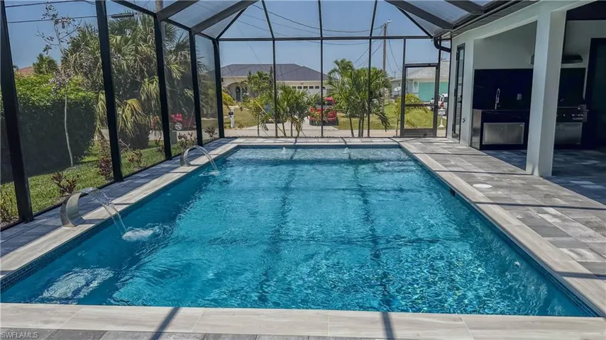 Pool featuring a lanai and a patio