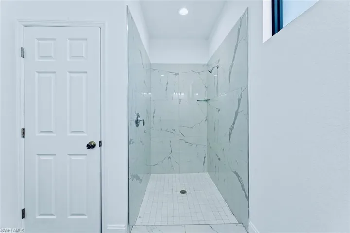 Bathroom featuring tiled shower