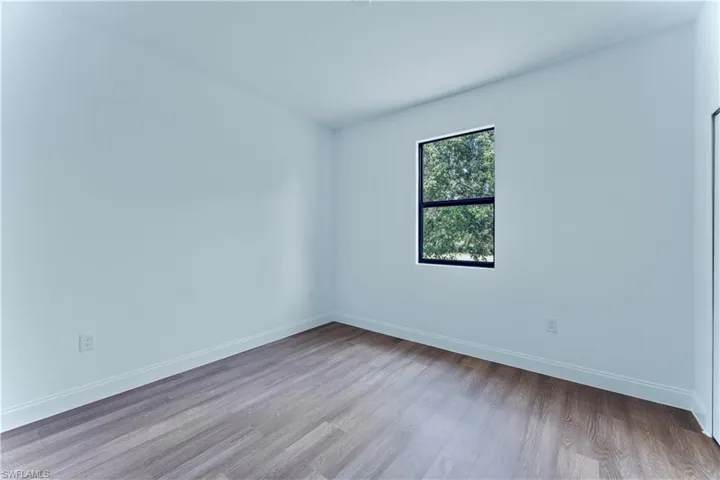 Unfurnished room with wood-type flooring