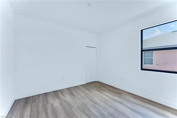 Empty room with light wood-type flooring