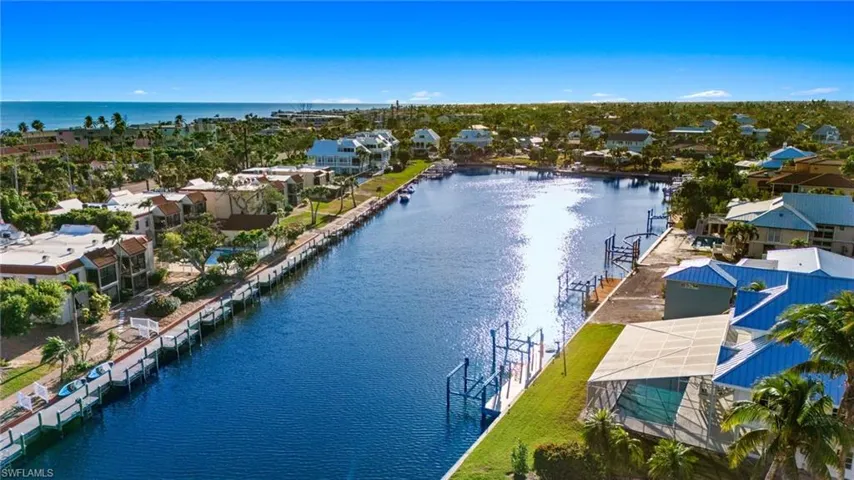 Aerial view of residential area with a large body of water