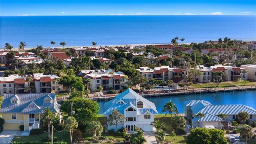 Aerial view of residential area with a nearby body of water