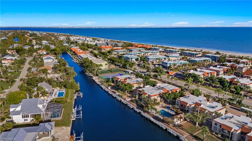 Aerial view of residential area with a large body of water