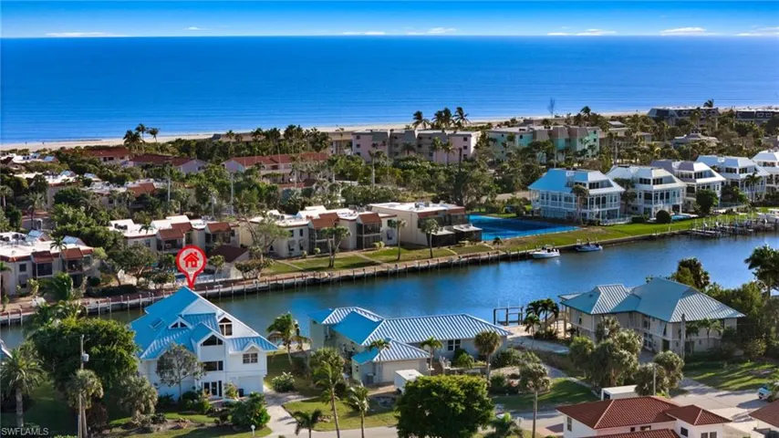 Aerial perspective of suburban area with a nearby body of water
