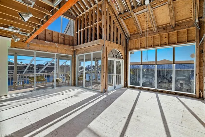 Great Room with a patio and lofted ceiling