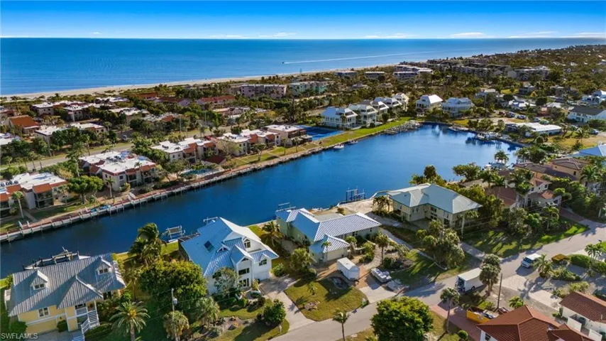 Aerial perspective of suburban area with a large body of water