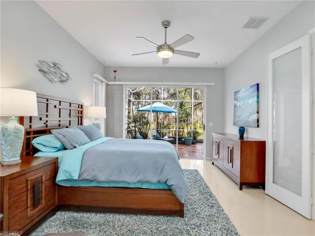 Bedroom with ceiling fan and access to exterior