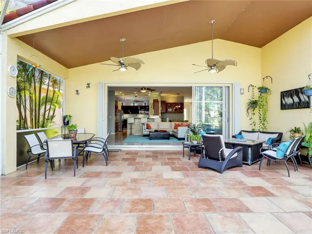 View of patio featuring an outdoor hangout area and ceiling fan