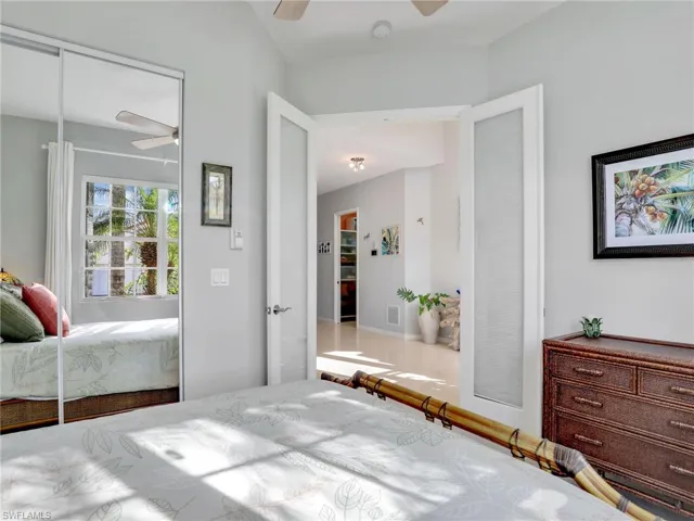 Bedroom featuring ceiling fan and a closet