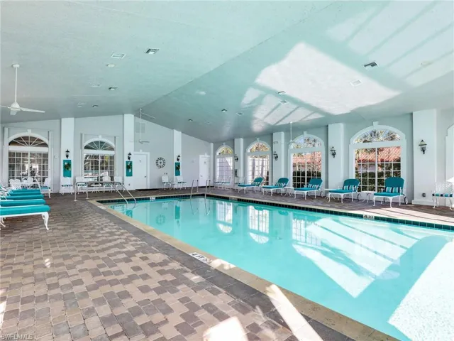 View of swimming pool with ceiling fan