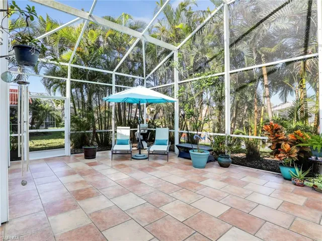 View of patio / terrace featuring a lanai