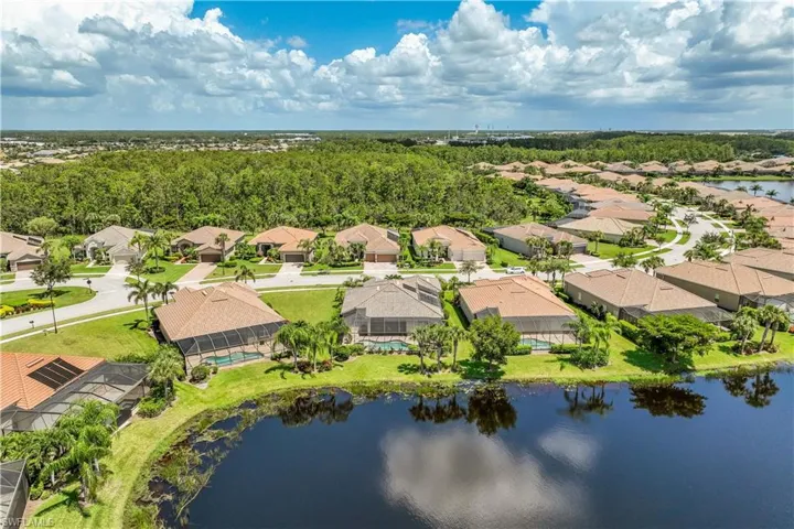 Aerial view featuring a lake view